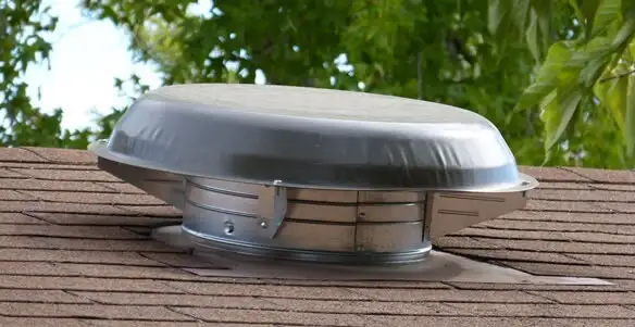 attic fan installation services with low-profile roof ventilation unit in Chicago, IL