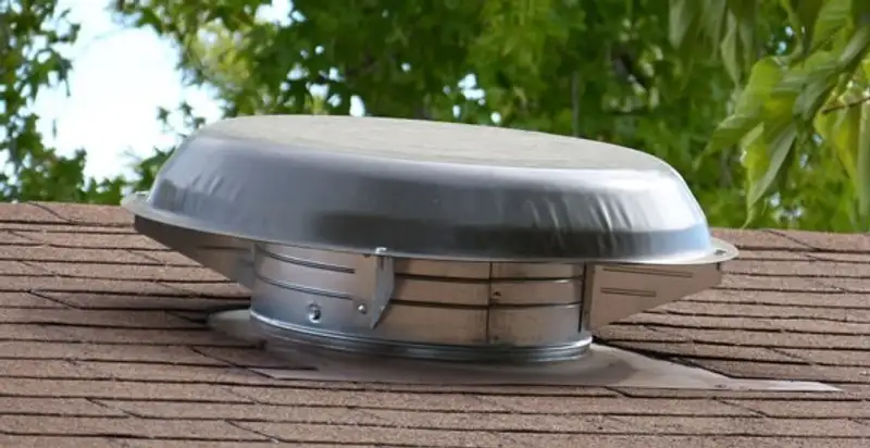 attic fan installation services with low-profile roof ventilation unit in Chicago, IL