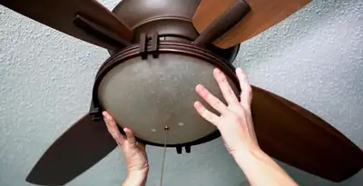 Ceiling fan repair and reinstallation on ceiling mount in Chicago, IL