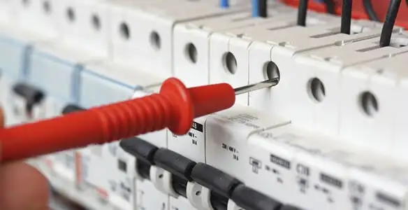 Electrical contractor testing circuit breakers during electrical repair in Berwyn, IL
