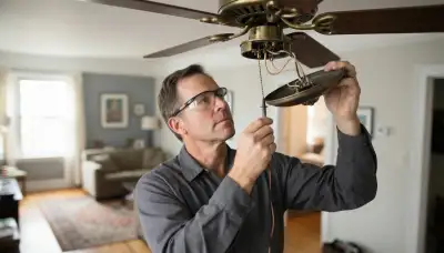 Chicago, IL electrician uses a multimeter to diagnose a ceiling fan pull-chain switch