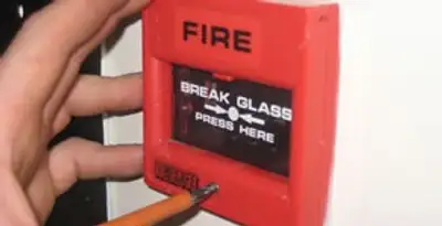 fire alarm installation service showing manual fire alarm pull station installed by licensed electricians in Chicago, IL