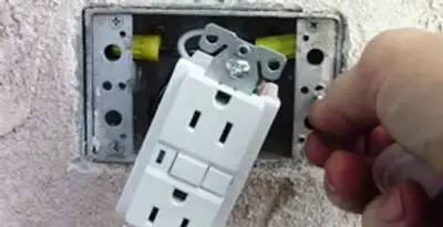 gfci circuits service showing installation of a ground fault circuit interrupter outlet by licensed electricians in Chicago, IL