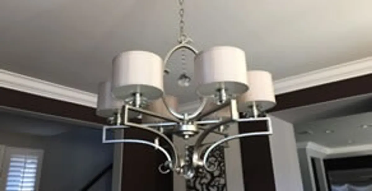 Modern chandelier installation with multiple light fixtures in Chicago, IL
