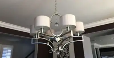 Modern chandelier installation with multiple light fixtures in Chicago, IL