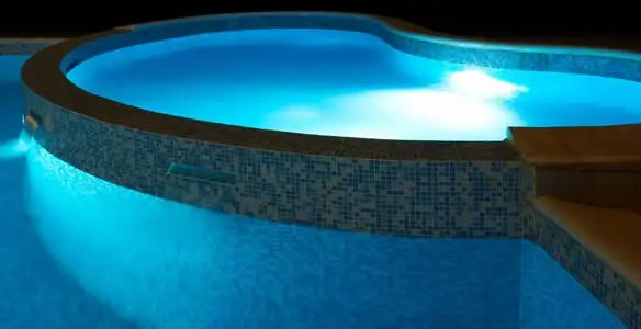 pool light installation and repair services highlighting illuminated pool interior lighting in Chicago, IL