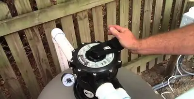 pool pumps service showing professional adjustment of pool pump control system in Chicago, IL