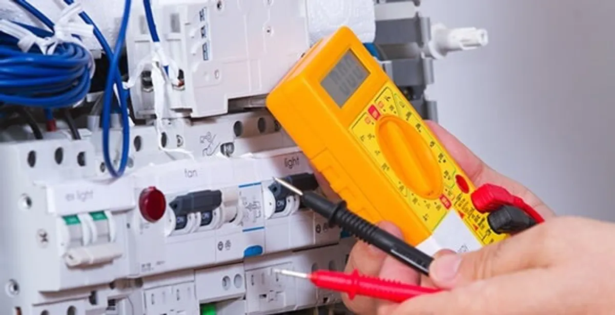 Residential electrician testing home electrical panel for safety and performance in Chicago, IL