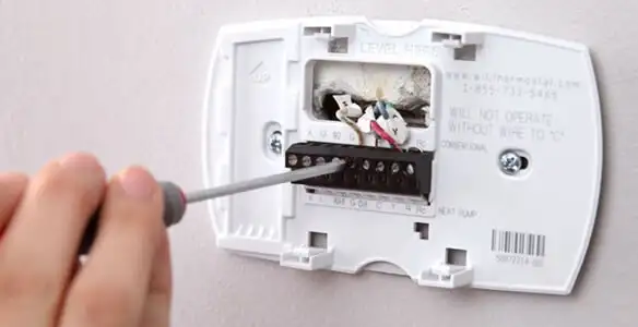 Thermostat installation service with proper wiring and secure wall mounting in Chicago, IL