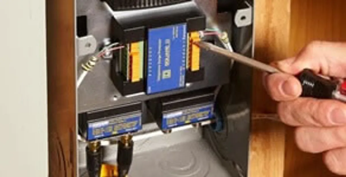 Whole home surge protection device being installed by a licensed electrician to protect electrical systems in Chicago, IL